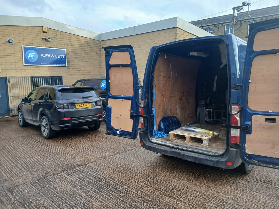 Professional delivery worker in blue uniform holding a package